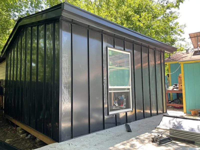 Black standing seam metal wall panels for Roof Inspection in Enoch